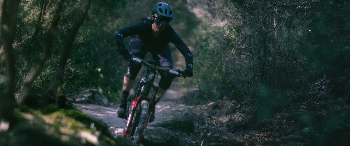 a person riding a bike on a trail